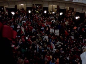 Image of the crowd at the University of Wisconsin protest. "The Eye of the Storm"--Image by Ken Dunbeck