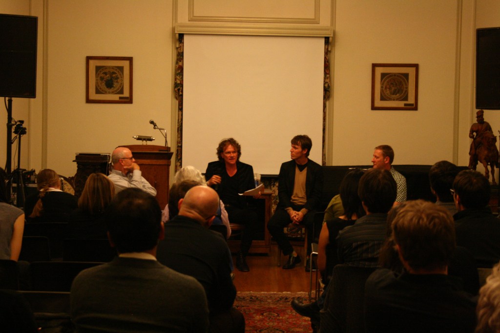 Image of four men talking, facing an audience. 
From Left: Tim Murray, Eric Lott, Tom McEnaney, and Marcus Boon, Image by Renate Ferro