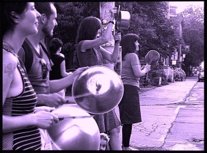 An image of casseroles protesters in Montreal, with a purple filter over it
