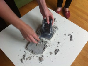 close up of the cement tape case being smashed