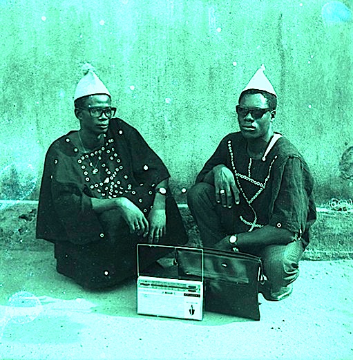 Two friends listen to the radio in the Ivory Coast, 1960s, image courtesy of the BBC Archives