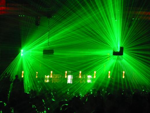 Lasers in a dance club, image by flickr user gabriel.jorby