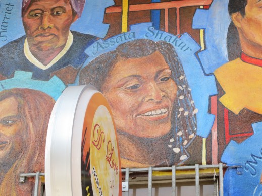 Image of Assata Shakur on Community Mural of Revolutionary Heroes, Image by Flickr User Gary Stevens