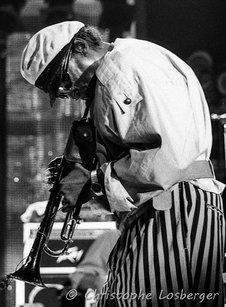 Miles Davis @ Montreux, bent over his trumpet 8.7.1984 Image by Flickr user Christophe Losberger