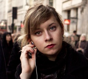 "Listening, Regent Street, London, 17 December 2011" by Flickr user John Perivolaris, CC BY-NC-ND 2.0