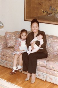 The author's mother, with the author's sister and the author. Picture is property of the author.