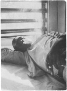"Lightnin' Washington, an African American prisoner, in the prison hospital at Darrington State Farm, Texas" by Alan Lomax.  