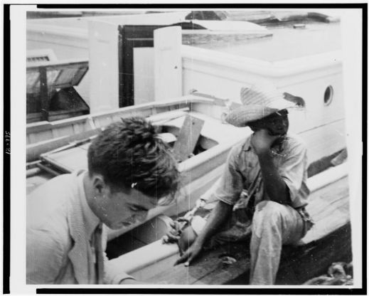 [Alan Lomax (left) youngster on board boat, during Bahamas recording expedition], 1935, Courtesy of the Library of Congress