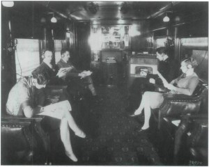 Passengers listening to radio broadcast aboard train, location unknown, 1929