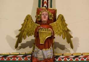 Detail of an angel with a musical instrument at All Saints' Church on North Street in York. Image by Lawrence OP @Flickr CC BY-NC-SA.