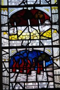 Stained glass depicting burning forests from a Richard Rolle poem at All Saints' Church on North Street in York. Image by dvdbramhall CC BY-NC-SA.