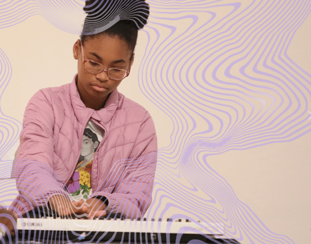 A young Black girl, around 8-10 years old, is deep in concentration, playing music on a small white yamaha keyboard. She is wearing a pink jacket over a shirt with flowers and a woman's face on it. Her hair is pulled up, and she wears glasses. There are stylized purple contour lines layered on top of the image, which is set against a cream colored background.